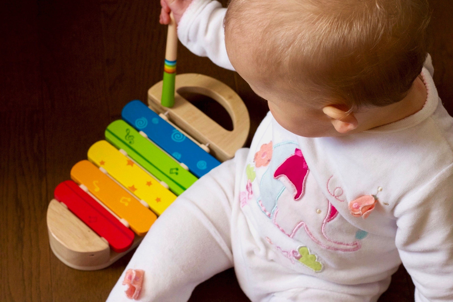 baby playing with toy